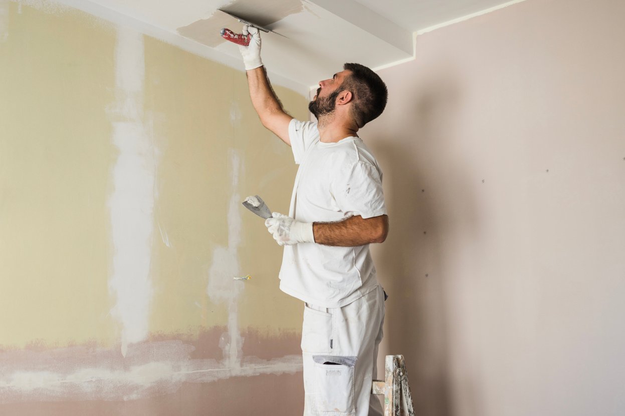 House painter painting ceiling